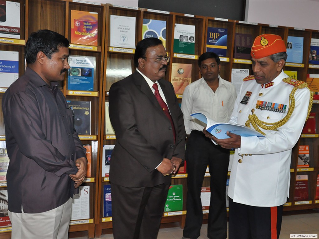 (Rtd) Lieutenant General Ramesh Halagali going through the journal Medica Innovatica